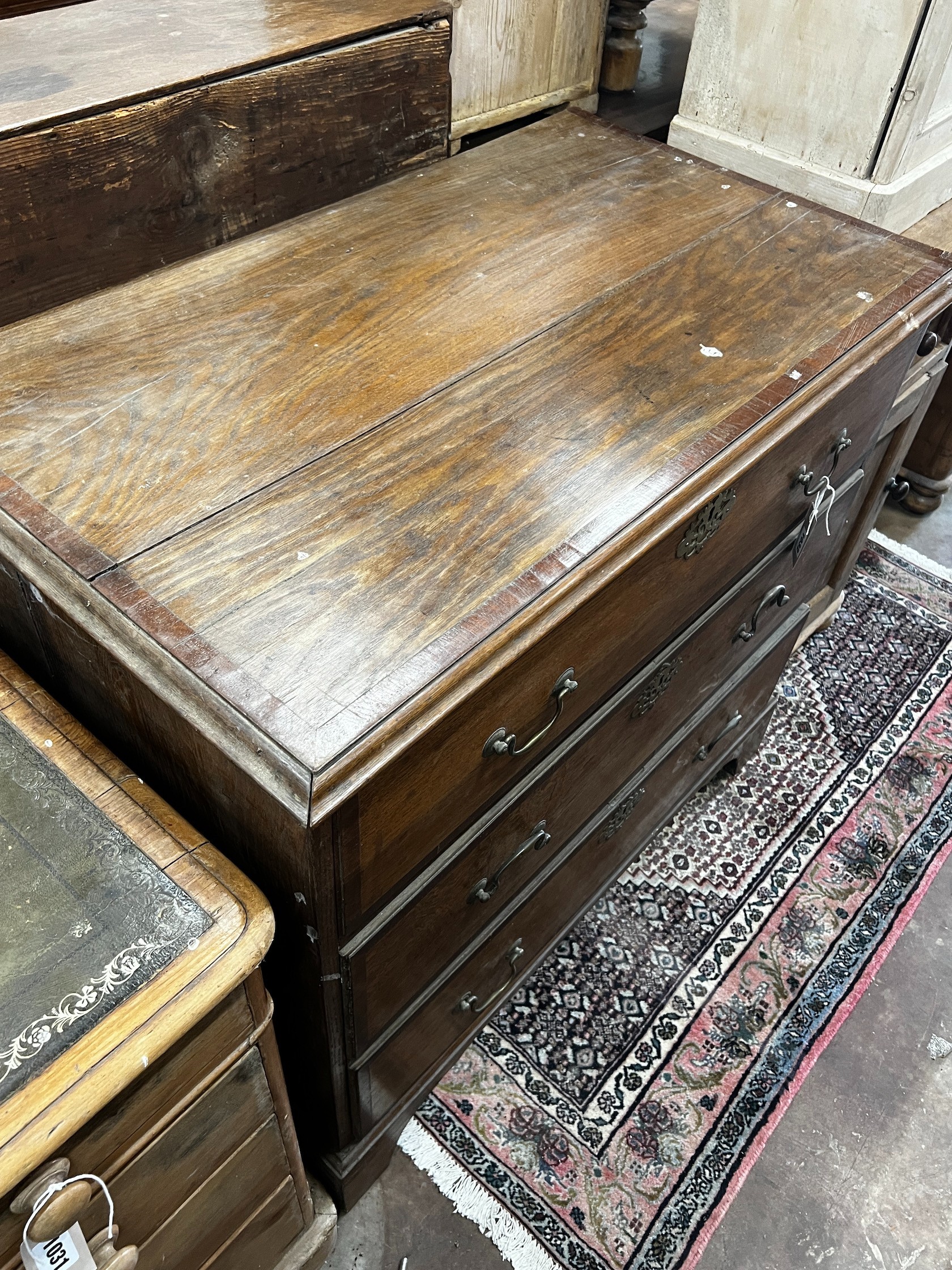 A George III banded oak chest of three drawers, width 96cm depth 54cm height 87cm